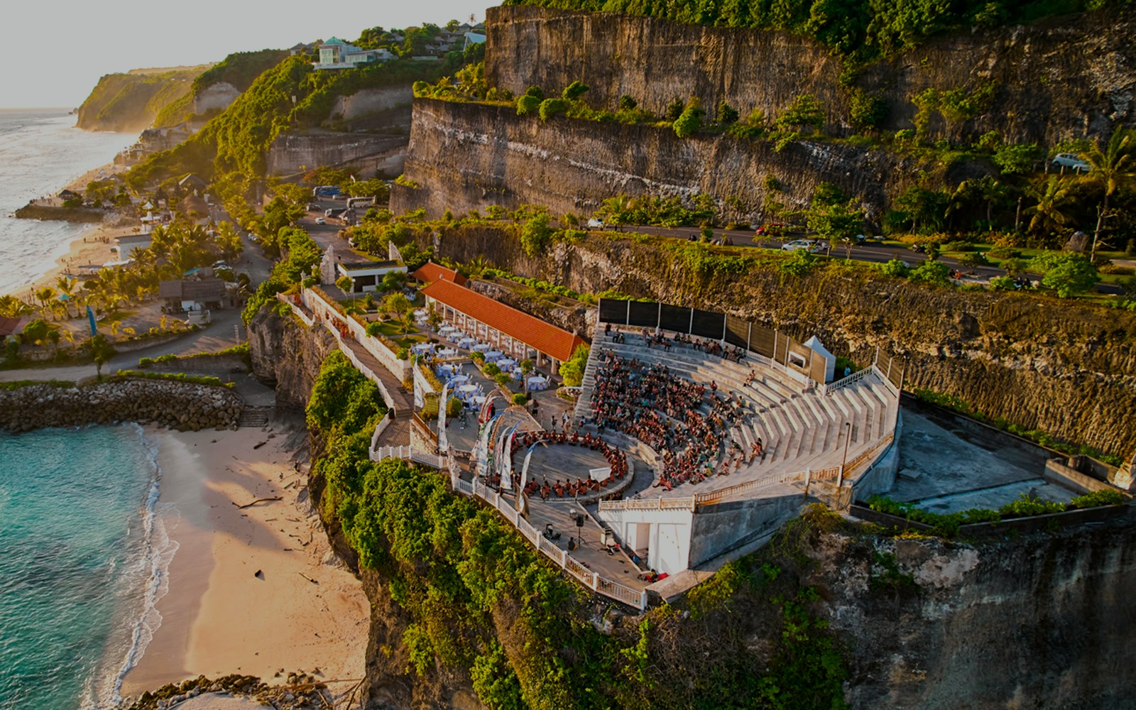 Kecak and Fire Dance Show amphitheater at Melasti Beach, Bali, with ocean view.