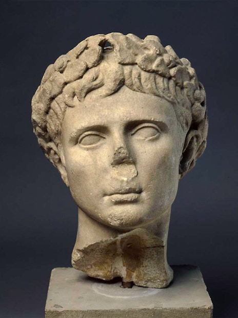 Sculpture of Augustus, first Roman Emperor, displayed on a pedestal.
