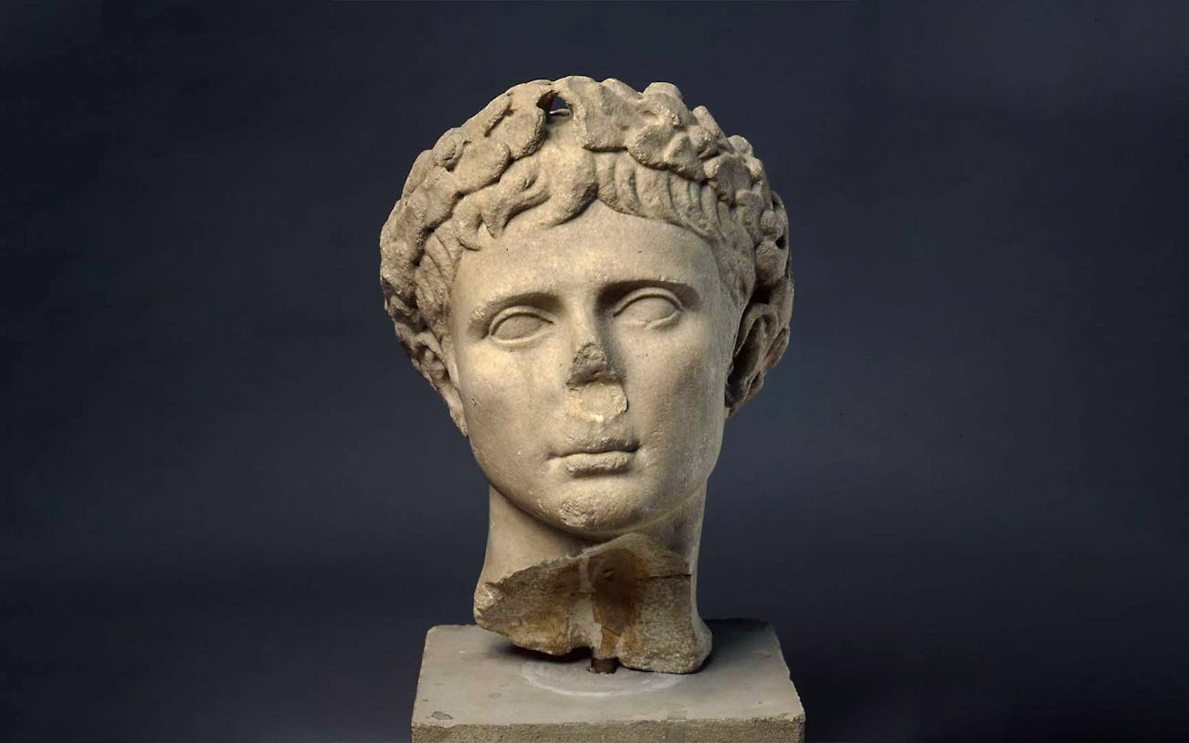 Sculpture of Augustus, first Roman Emperor, displayed on a pedestal.