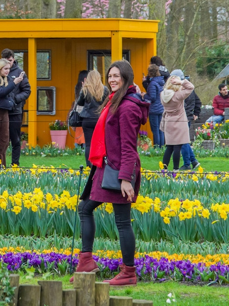 Guests photographing vibrant flowers at Keukenhof Gardens, Netherlands.