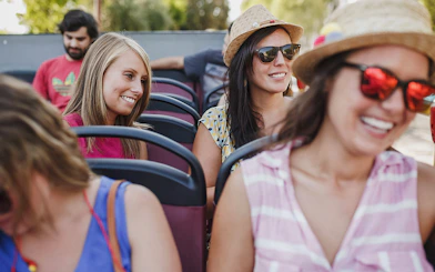 Girls enjoying a hop-on hop-off bus tour in Benalmadena.