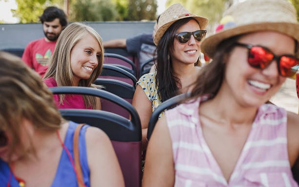 Girls enjoying a hop-on hop-off bus tour in Benalmadena.