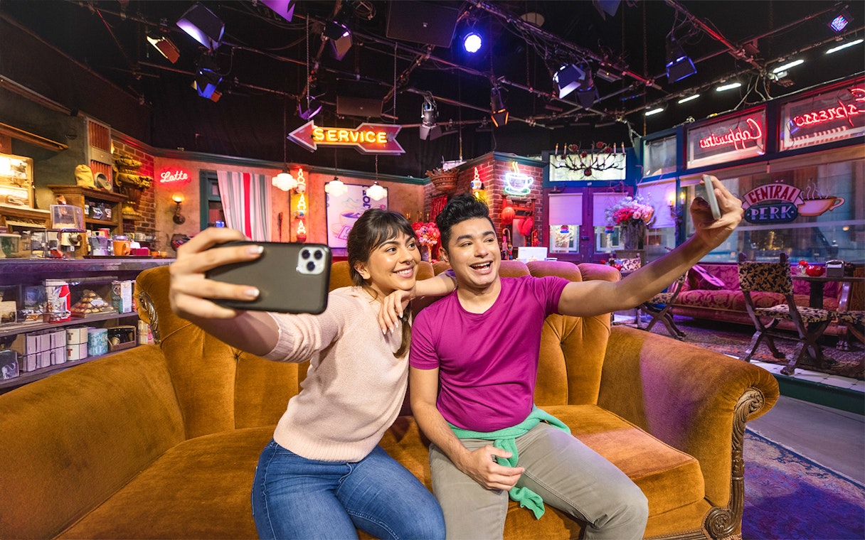 Visitors taking selfies on the Central Perk set at Warner Bros. Studios Hollywood.