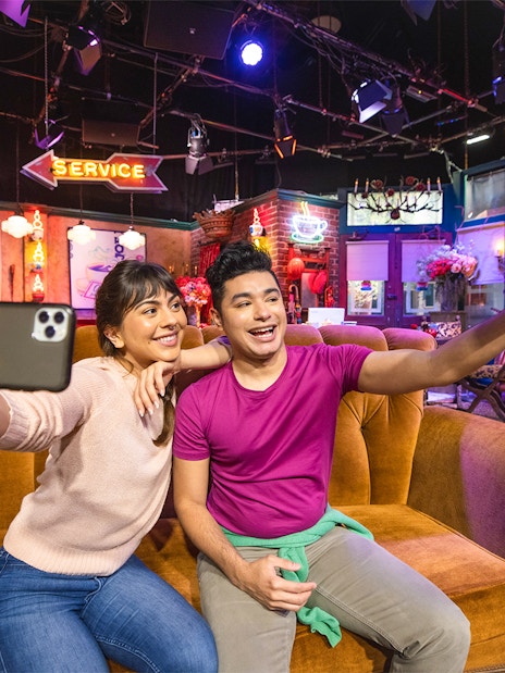 Visitors taking selfies on the Central Perk set at Warner Bros. Studios Hollywood.