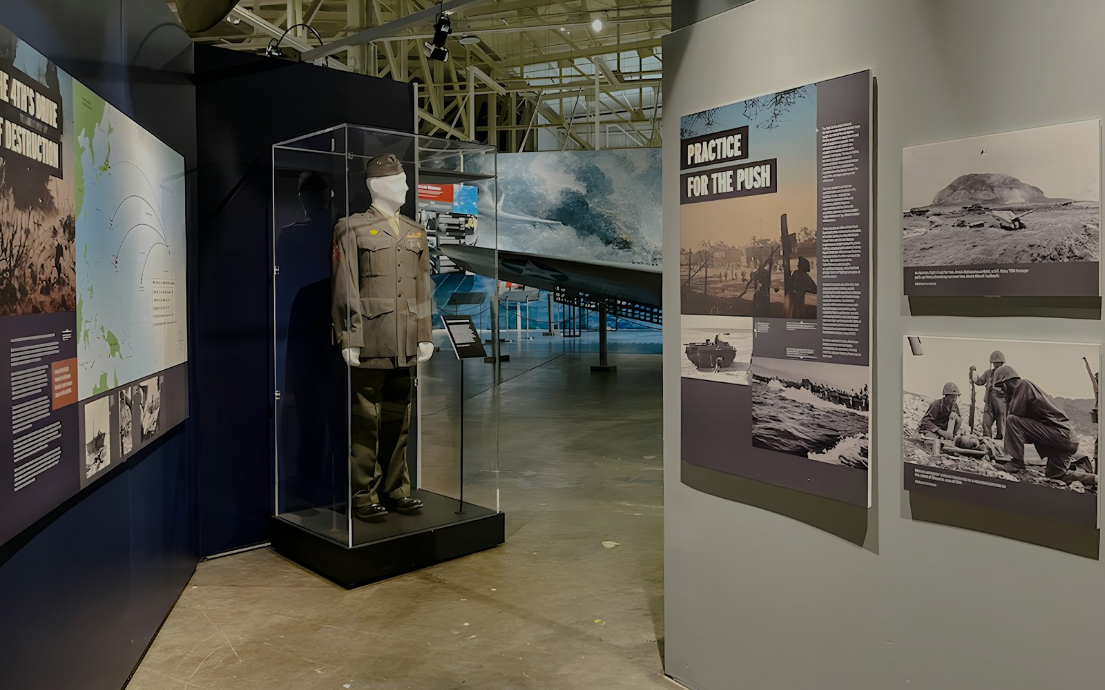 Exhibit of military uniform and historical displays at Pearl Harbor Aviation Museum.