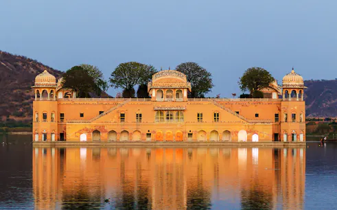 Jal Mahal palace reflecting in Man Sagar Lake, Jaipur, during a guided tour.