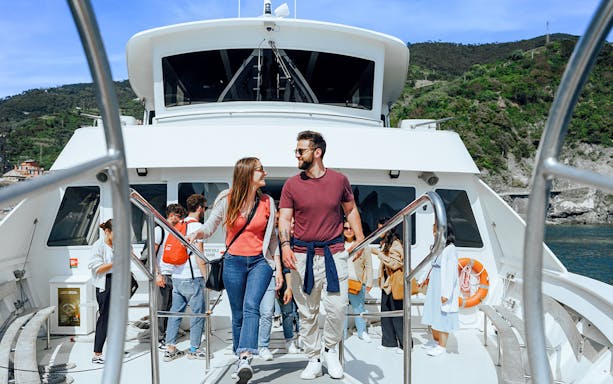 Participants enjoying a boat ride on a day trip to Cinque Terre, Italy.