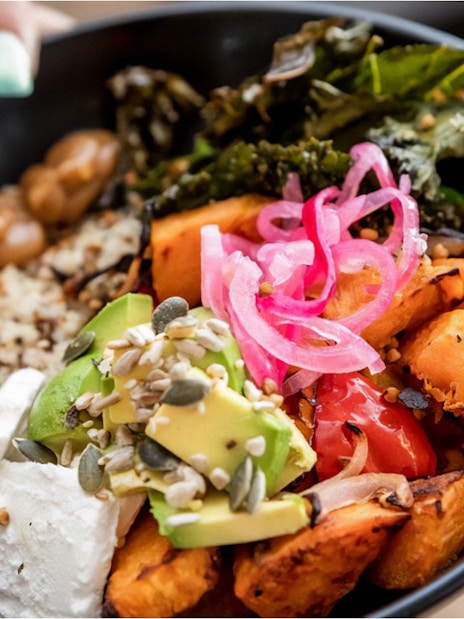 Healthy bowl with avocado, pickled onions, roasted vegetables, and seeds, part of the SEA LIFE Sunshine Coast tour.