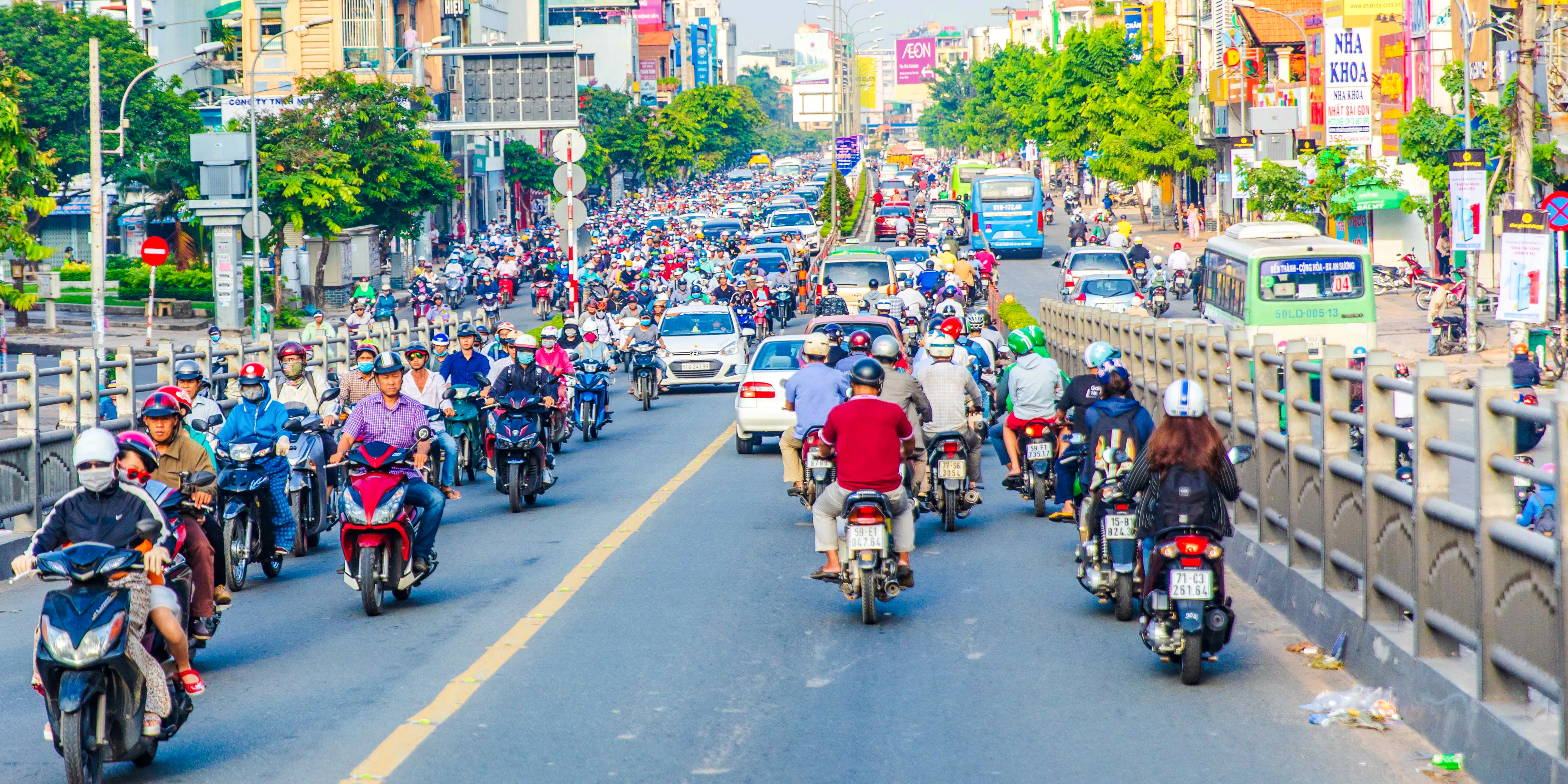 Motorbikes on a busy street in Ho Chi Minh City during a Saigon street food tour.