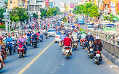 Motorbikes on a busy street in Ho Chi Minh City during a Saigon street food tour.