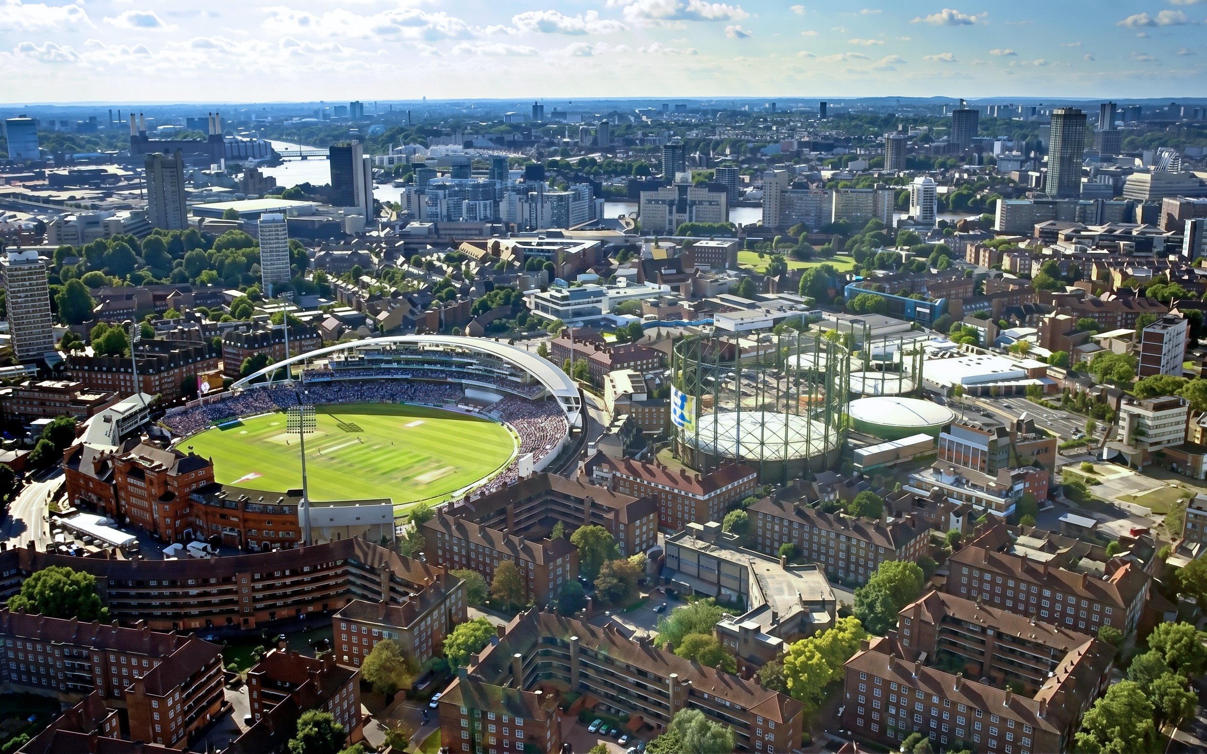 Aerial view of Kia Oval Stadium in London surrounded by cityscape.