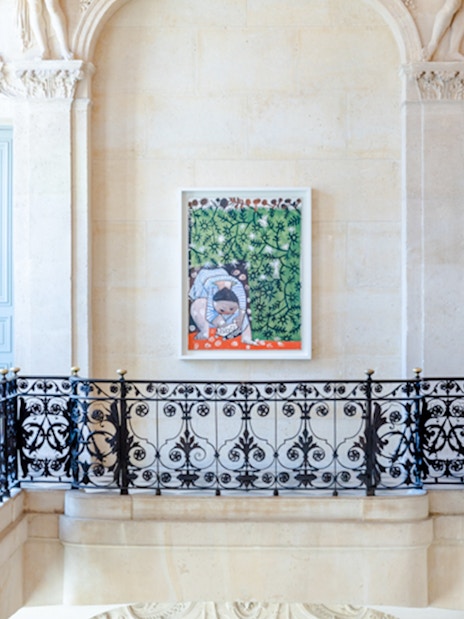 Artwork displayed in the Picasso Museum, Paris, featuring a colorful painting on a decorative wall.