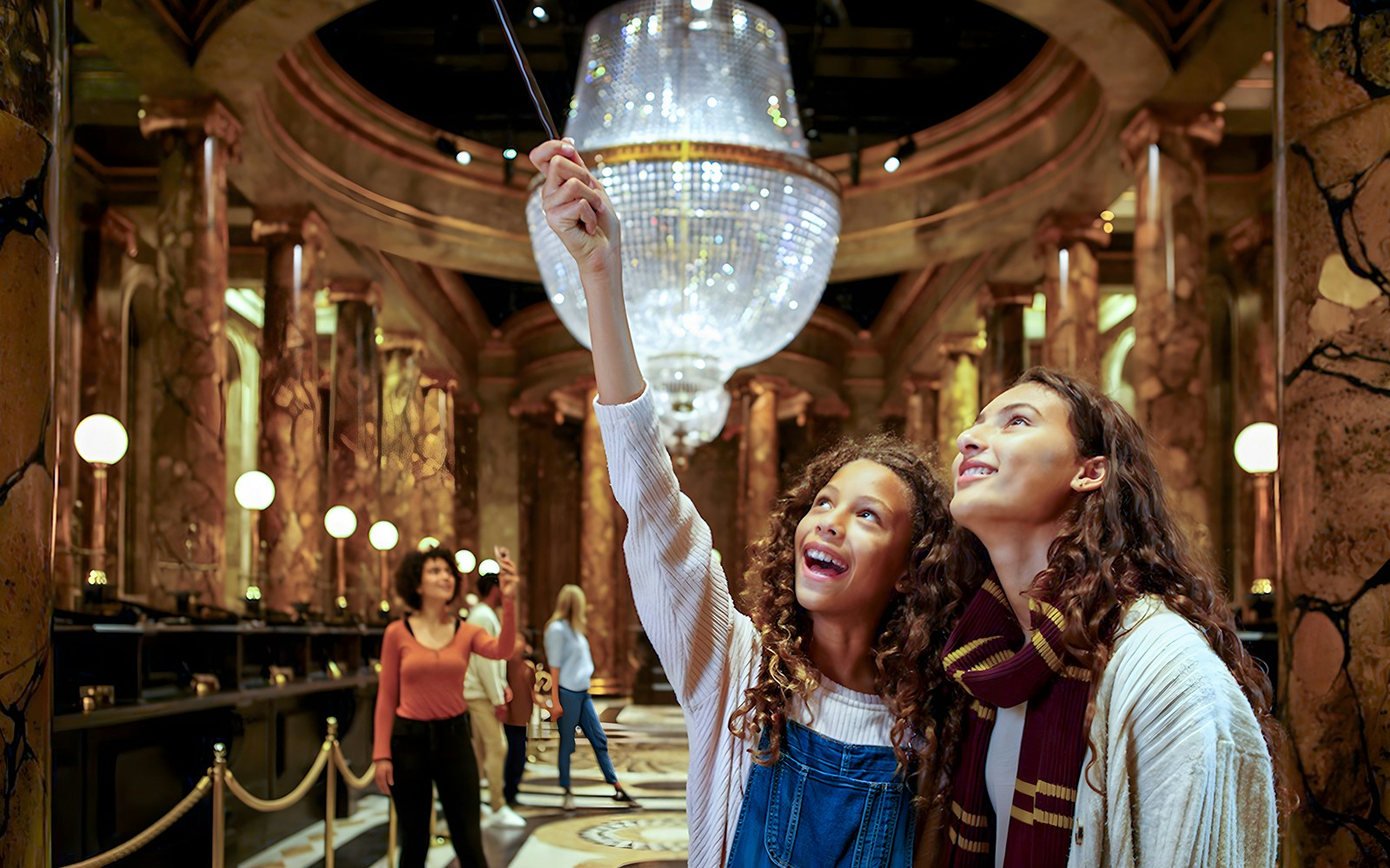 Visitors exploring Gringotts Wizarding Bank set at Warner Bros. Studio Tour London.