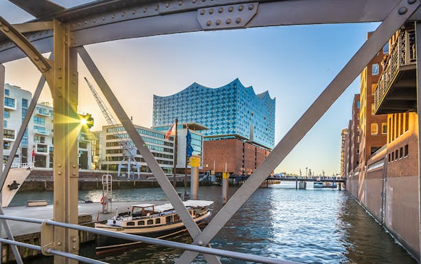 Elbphilharmonie Hamburg viewed from a bridge over the canal during Elphi Außenführung tour.