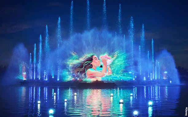 Disneyland World of Frozen Illuminations with vibrant water and light show.