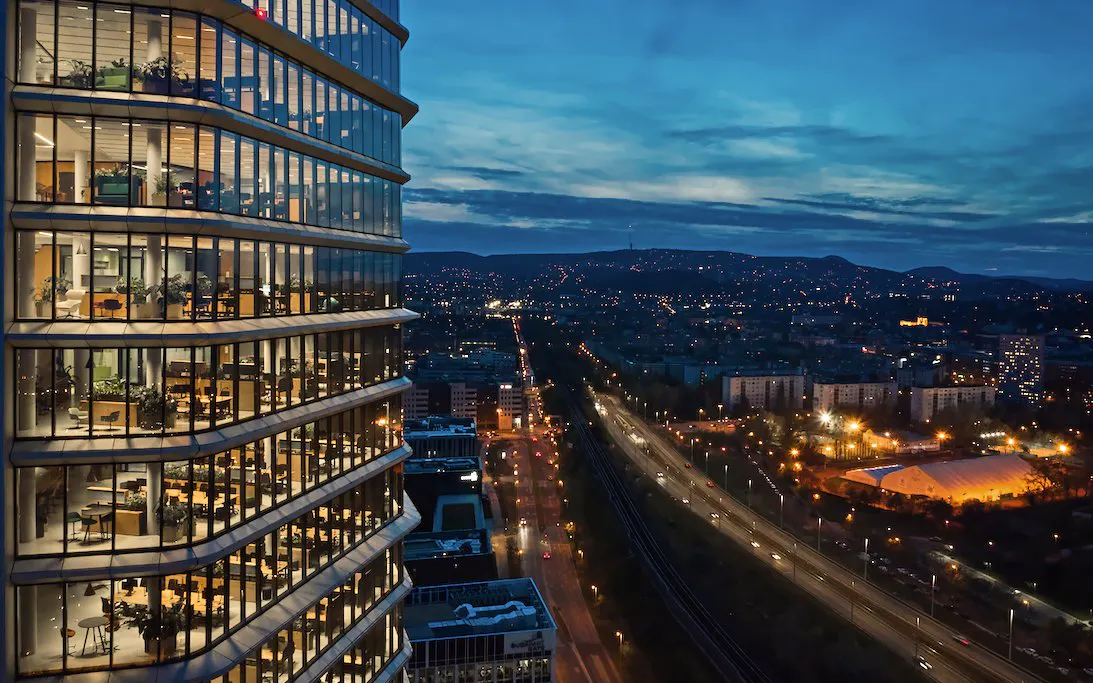 SkyDeck view from MOL Campus overlooking Budapest cityscape at dusk.