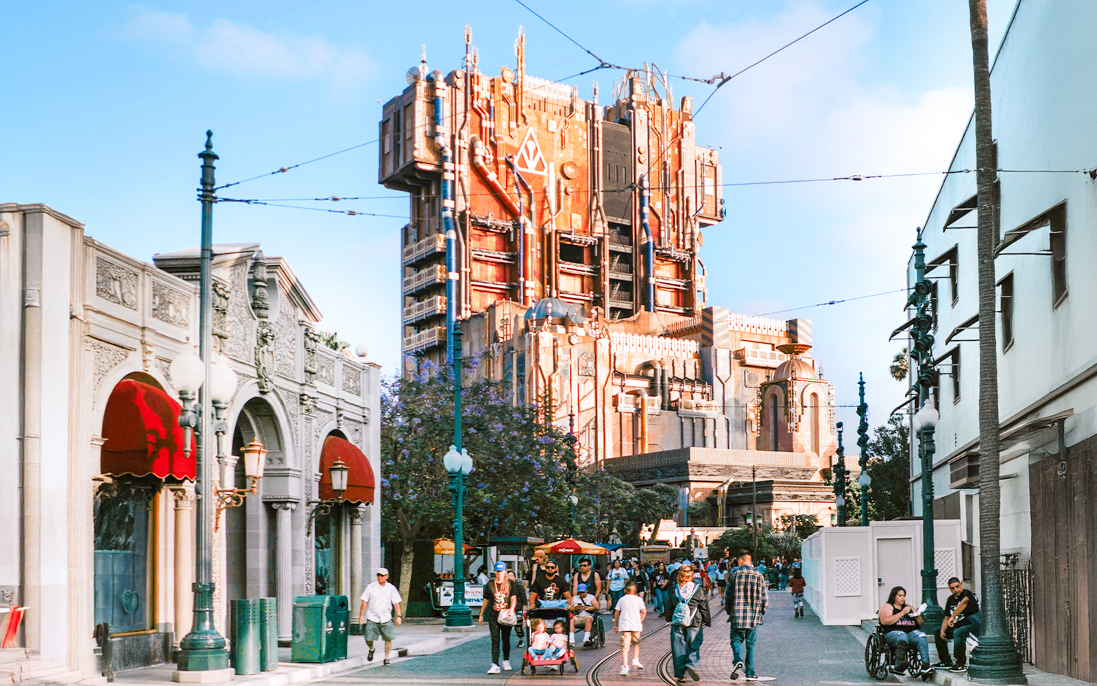 Guardians of the Galaxy HQ building at Disneyland, California with visitors walking nearby.
