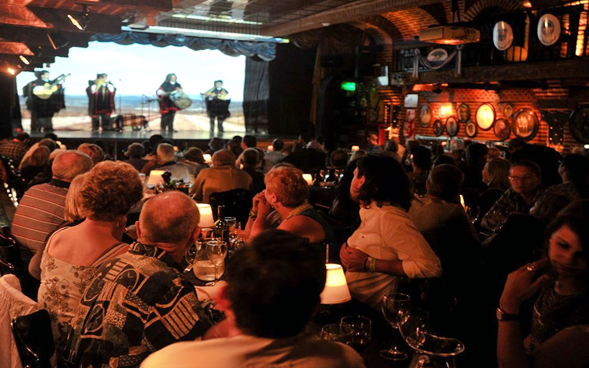 Audience enjoying live music at La Ventana Tango Show in Buenos Aires.