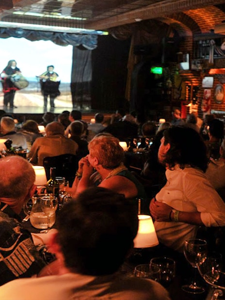 Audience enjoying live music at La Ventana Tango Show in Buenos Aires.