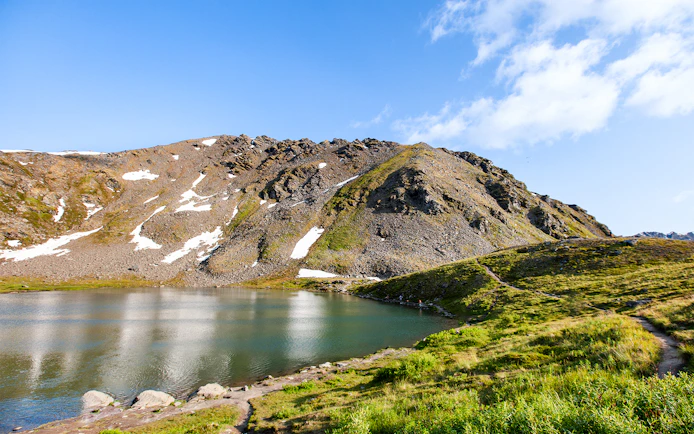 Alaska Railroad scenic view of a mountain and lake.