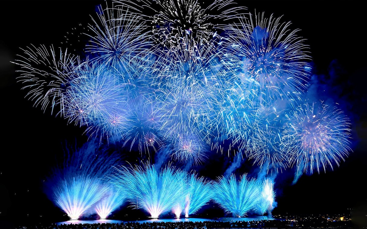 Fireworks display at night during Huis Ten Bosch event in Japan.