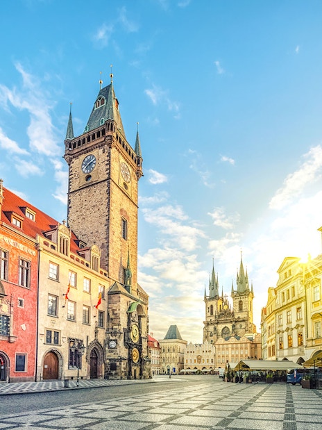 Old Town Hall with clock tower on Old Town Square, Prague, under a clear sky.