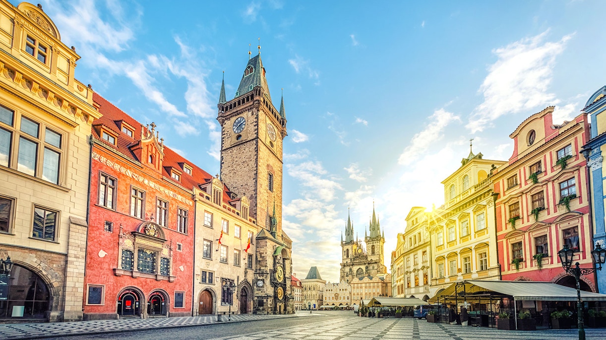 Old Town Hall with clock tower on Old Town Square, Prague, under a clear sky.