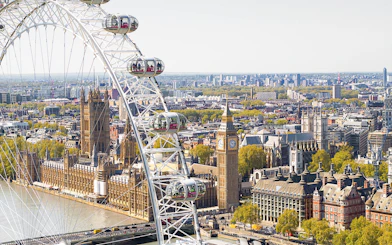 London Eye Ferris wheel overlooking Big Ben and the Houses of Parliament.