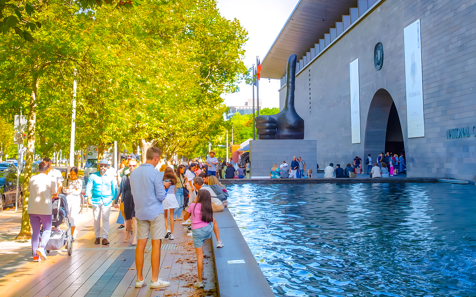 People walking near the entrance of the National Gallery of Victoria, Melbourne.