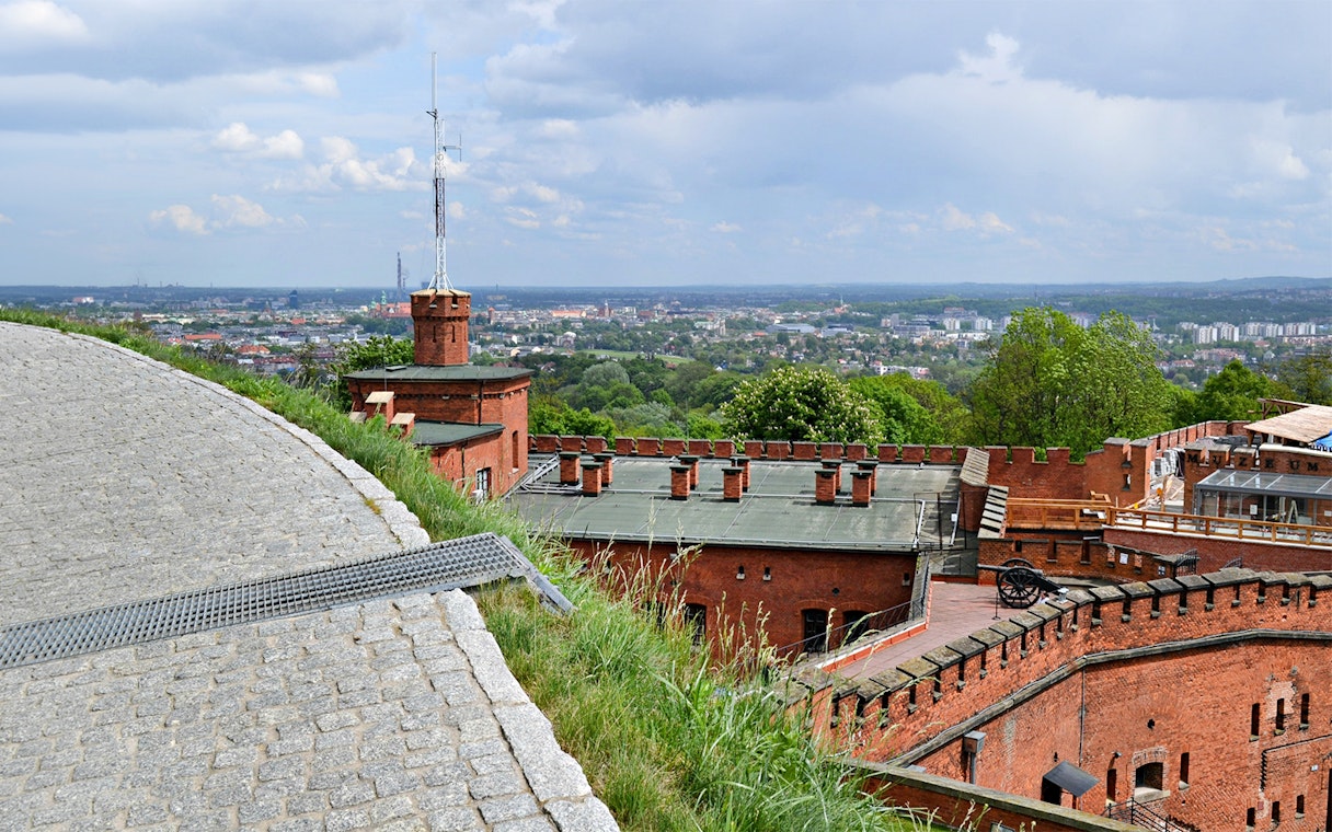 Kościuszko Mound in Krakow with panoramic city view and historic brick fortifications.