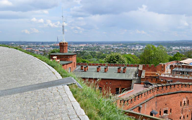 Kościuszko Mound in Krakow with panoramic city view and historic brick fortifications.