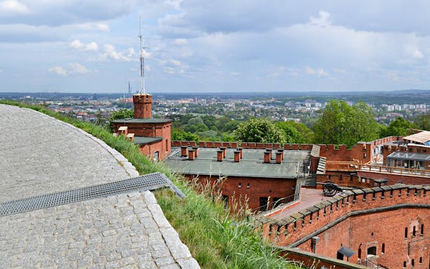 Kościuszko Mound in Krakow with panoramic city view and historic brick fortifications.