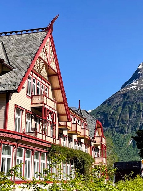 Hotel Union Øye with mountain backdrop in Hjørundfjord, Norway.