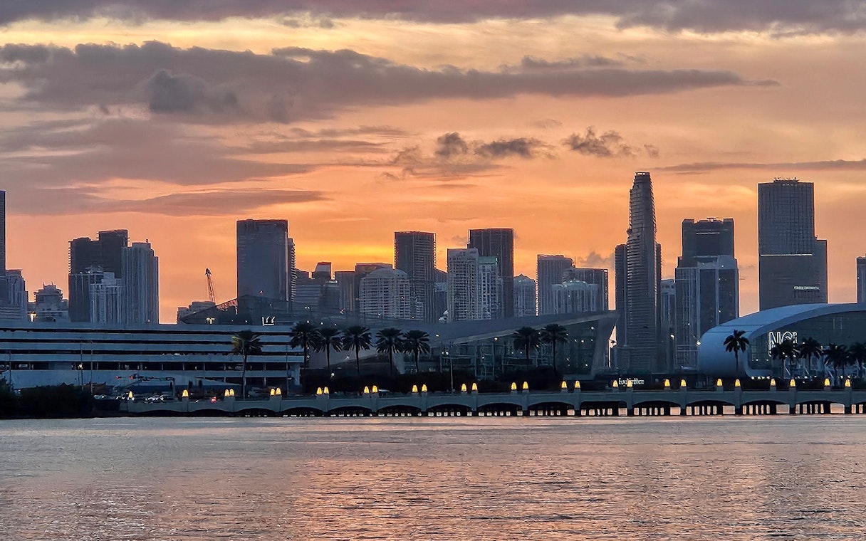 Sunset over Miami skyline viewed from Biscayne Bay during South Beach cruise.