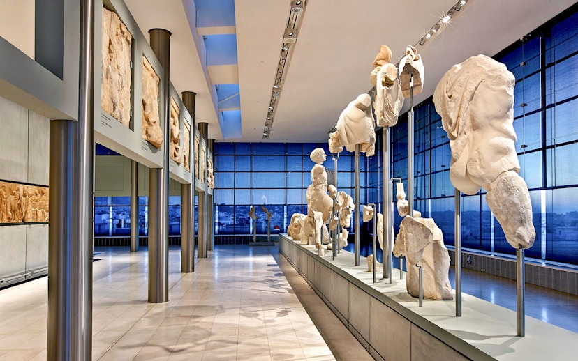 Ancient sculptures displayed in the Athens Acropolis Museum.