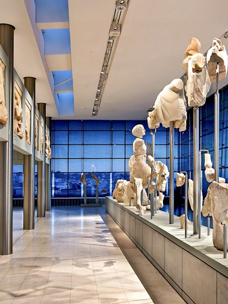 Ancient sculptures displayed in the Athens Acropolis Museum.