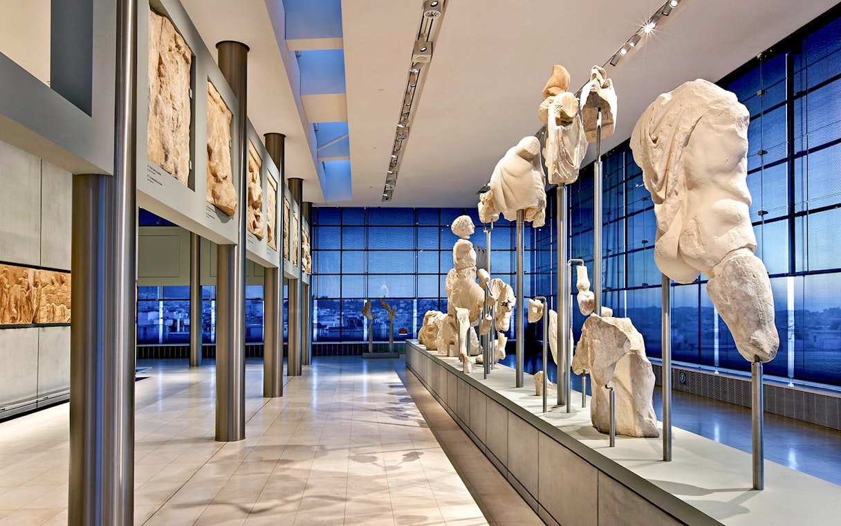 Ancient sculptures displayed in the Athens Acropolis Museum.