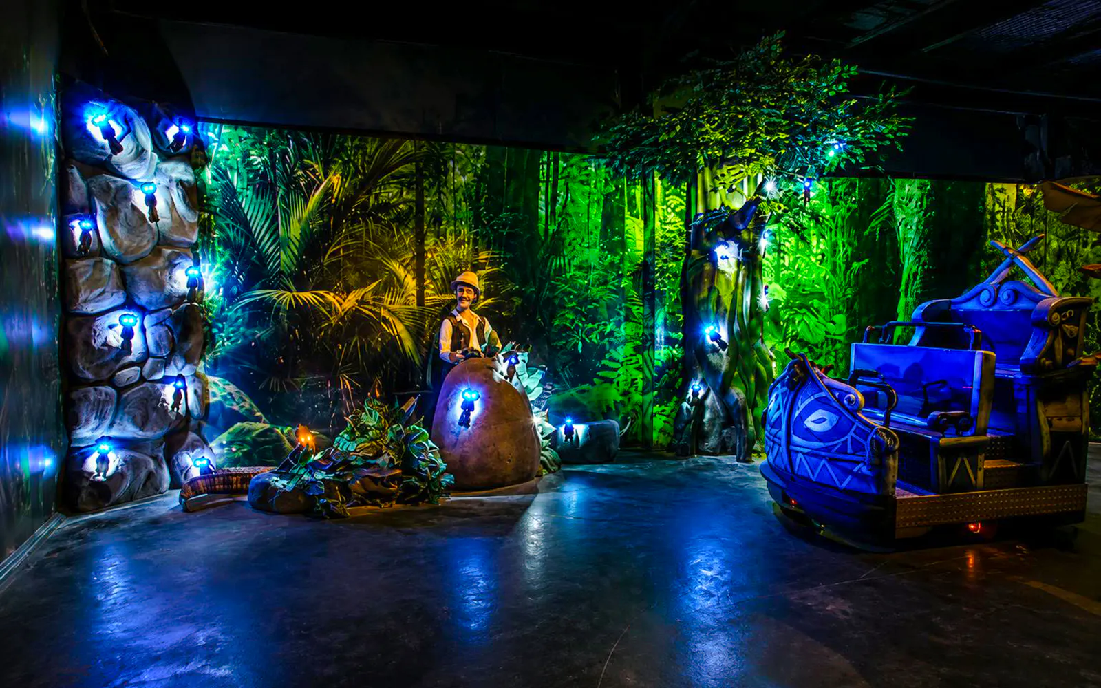 Guests enjoying illuminated jungle-themed ride at Vialand Theme Park, Istanbul.