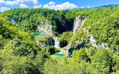 Aerial view of waterfalls and lush greenery at Plitvice National Park, Croatia.