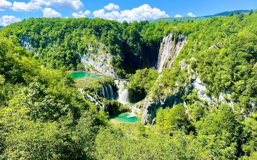 Aerial view of waterfalls and lush greenery at Plitvice National Park, Croatia.