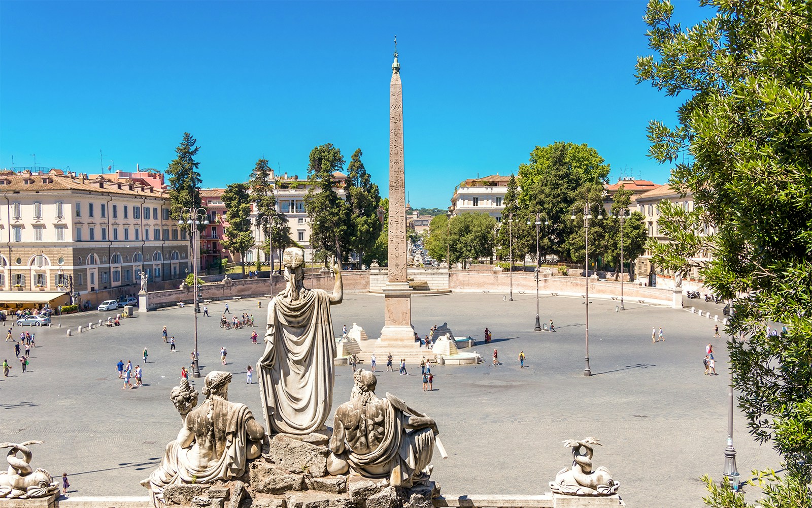 Piazza del Popolo with central obelisk and surrounding statues in Rome, Italy.