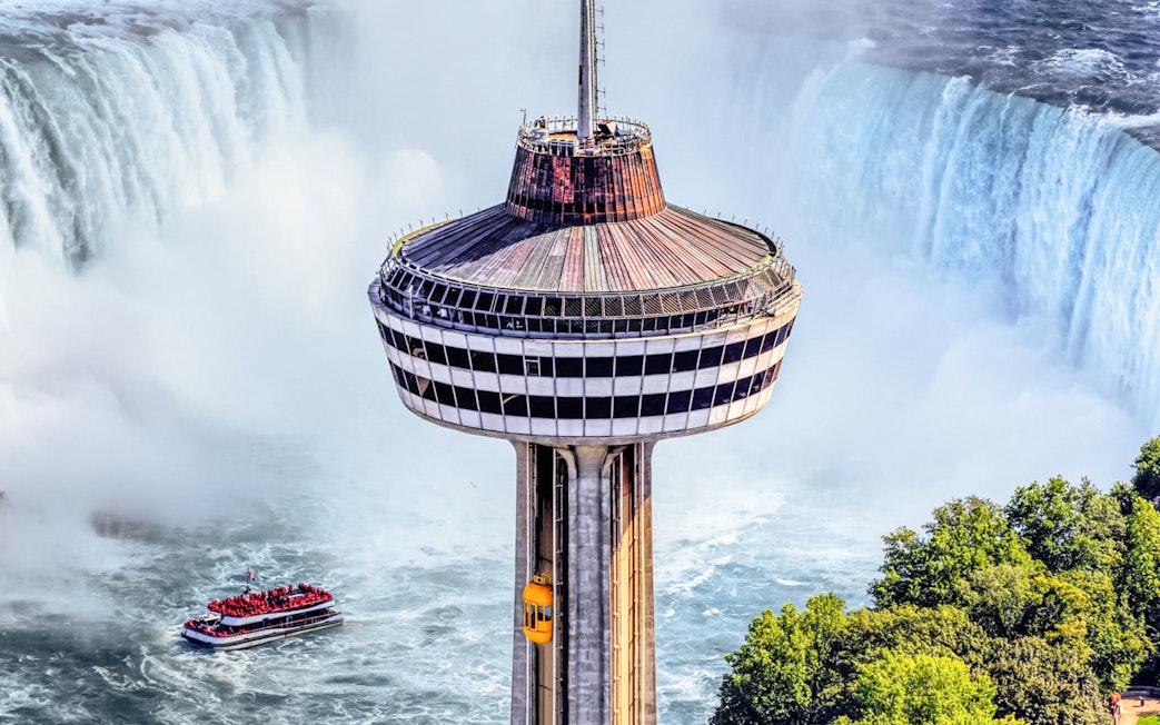 Skylon Tower overlooking Niagara Falls with Hornblower Cruise below.