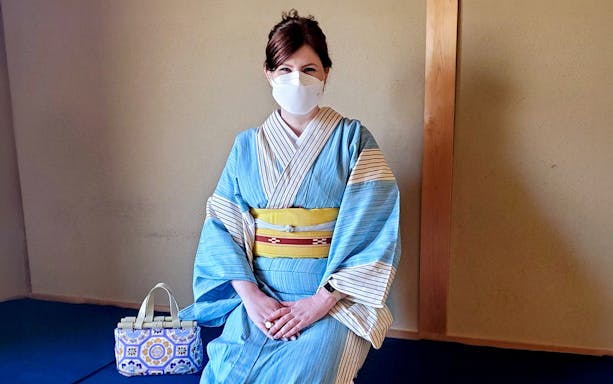 Person in kimono at Flower Teahouse, Kyoto tea ceremony experience.