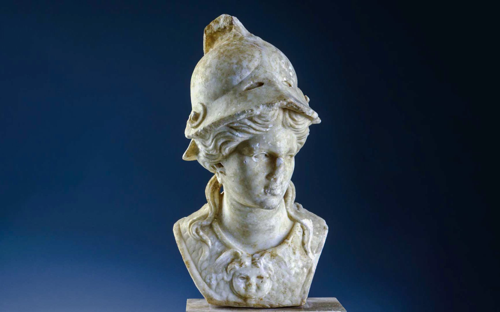 Roman marble statue of Athena wearing a helmet.