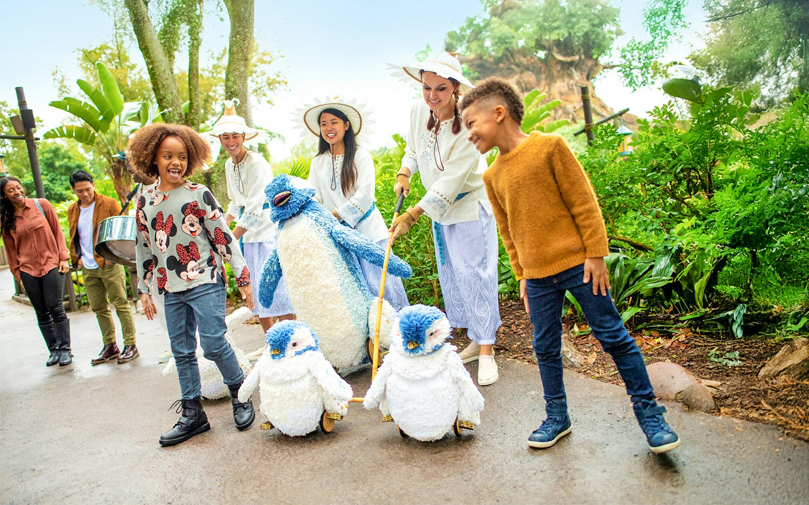 Guests with toy penguins at Walt Disney World Resort, Orlando.