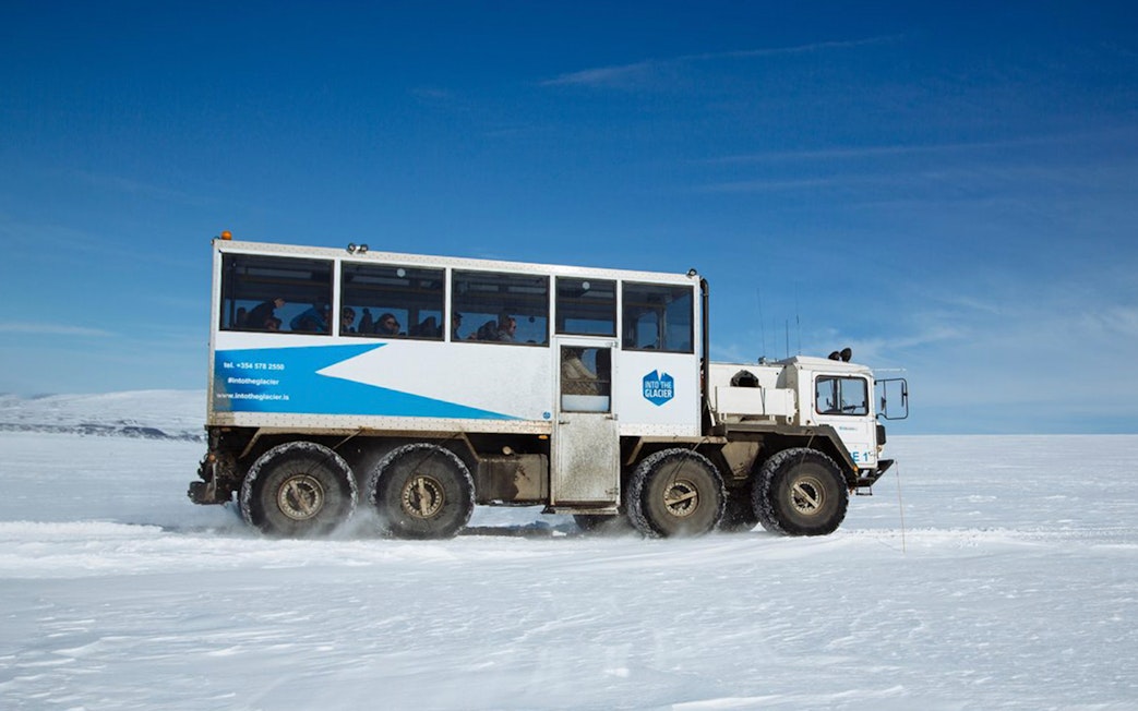 Guests traveling in a glacier vehicle from Husafell to Langjökull in Iceland.