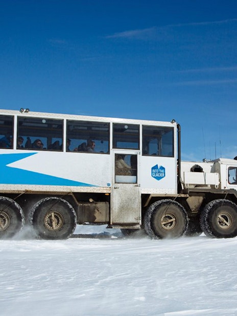 Guests traveling in a glacier vehicle from Husafell to Langjökull in Iceland.