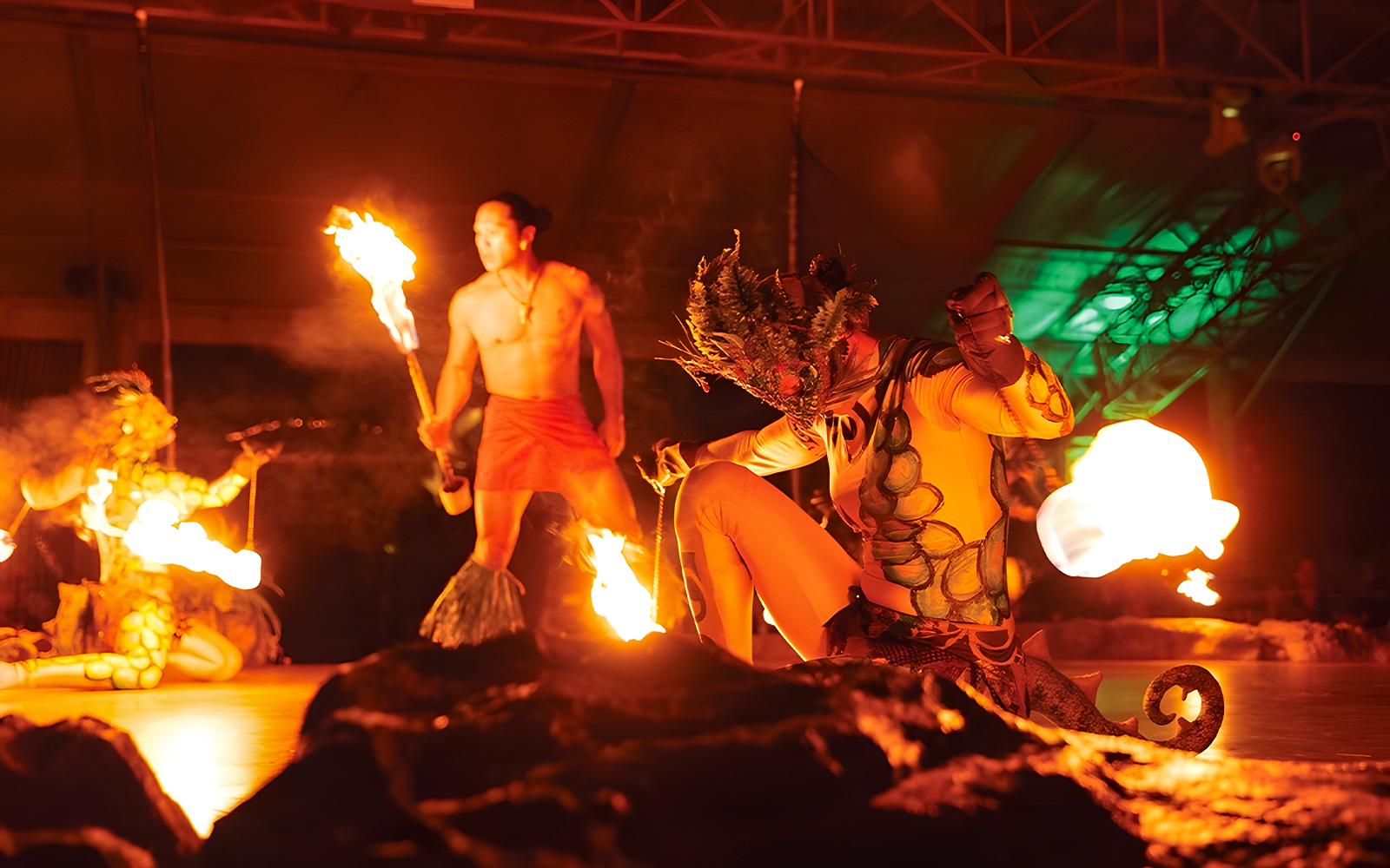 Fire dancers performing at Luau Kalamaku cultural show in Hawaii.