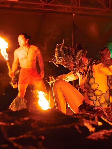 Fire dancers performing at Luau Kalamaku cultural show in Hawaii.
