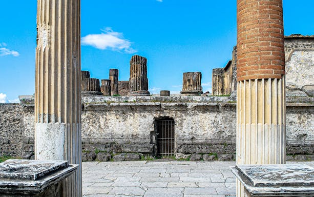 Ancient columns and stone ruins at Pompeii, Italy.